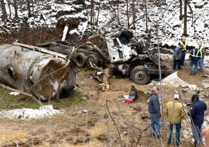 Water truck careens down embankment after driver loses control